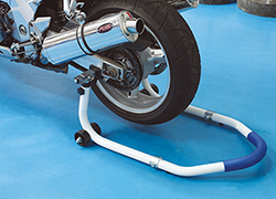 Combination motorcycle stand for front or rear wheels