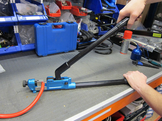 Using the Laser Tools 6922 Battery Terminal Crimping Tool to repair a battery terminal on the work bench.