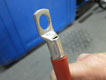 A battery terminal before being crimped with the Laser Tools 6922 Battery Terminal Crimping Tool.